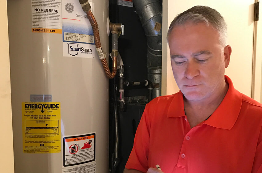 Shawn Inspecting Water Heater